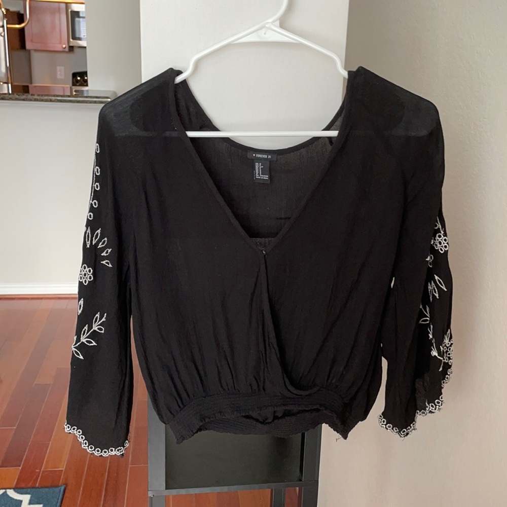 Black blouse with floral detailing